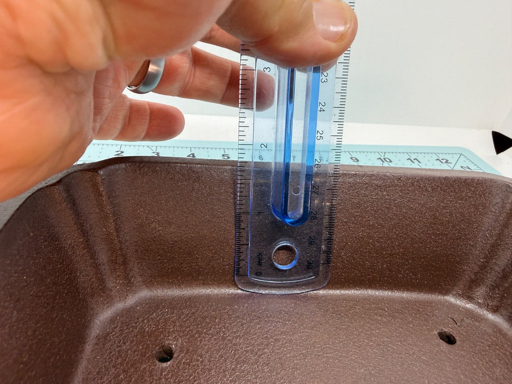Ruler inside the brown pot demonstrating its usable depth