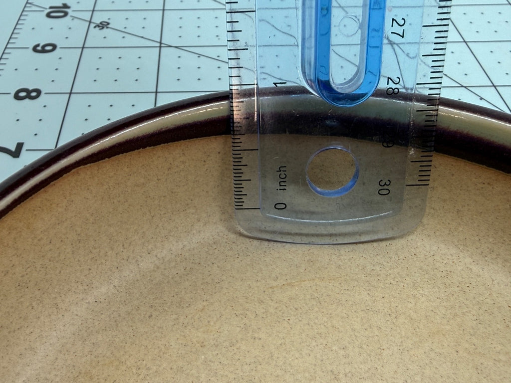 Ruler inside the shallow round pot demonstrating its usable depth