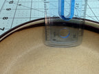 Ruler inside the shallow round pot demonstrating its usable depth