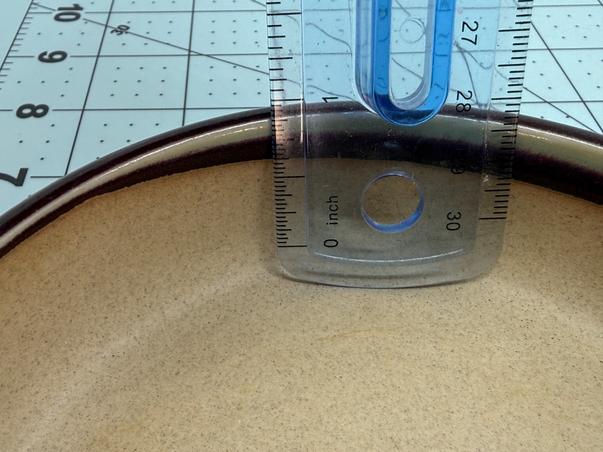 Ruler inside the shallow round pot demonstrating its usable depth