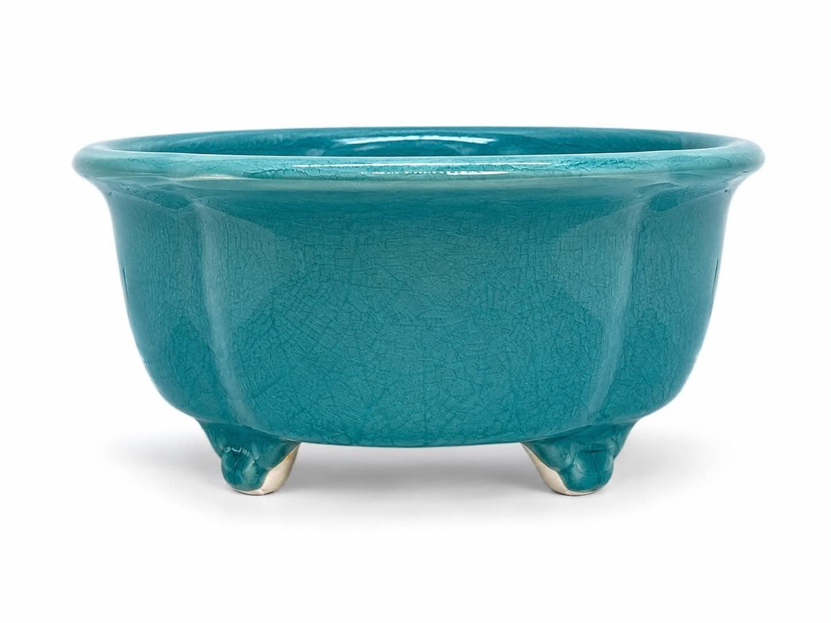 Turquoise-glazed lobed oval bonsai pot with flared rim and decorative feet