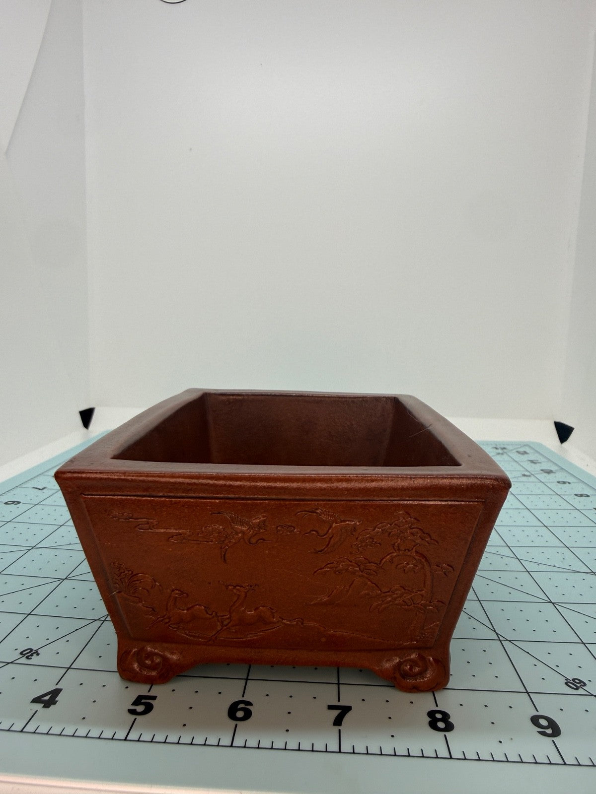 Opposite short-side view of the decorated rectangular pot