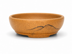 Ochre oval bonsai pot with dark mountain-line decoration and short feet