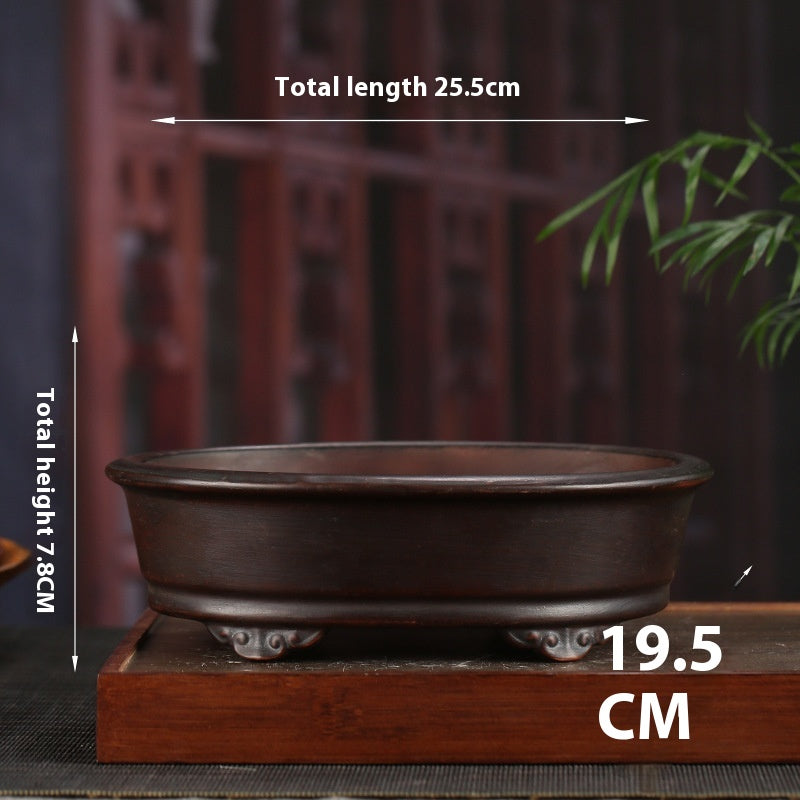 Waisted oval bonsai pot with exterior size annotation