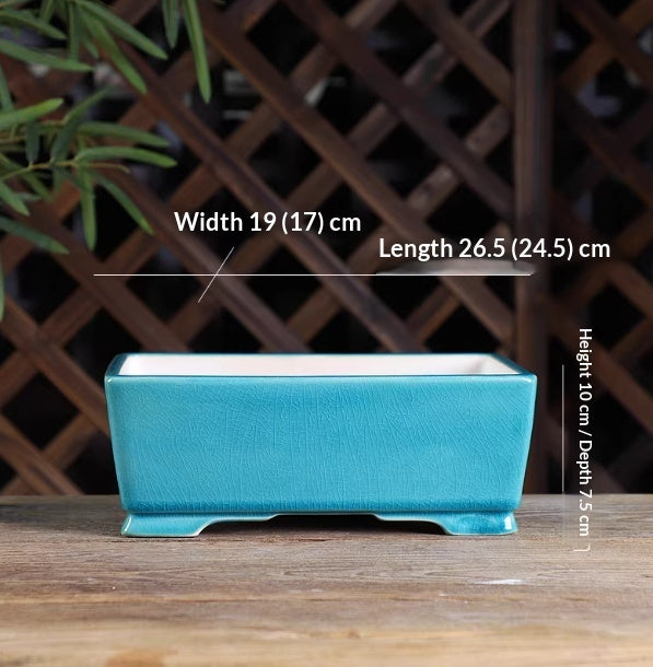 Turquoise rectangular bonsai pot with a pale interior and low feet, with measurement labels