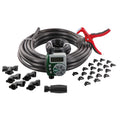 Orbit irrigation kit arranged on white with coiled tubing, digital timer, red cutting tool and black fittings