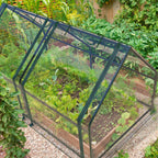 Portable mini greenhouse with both access doors raised