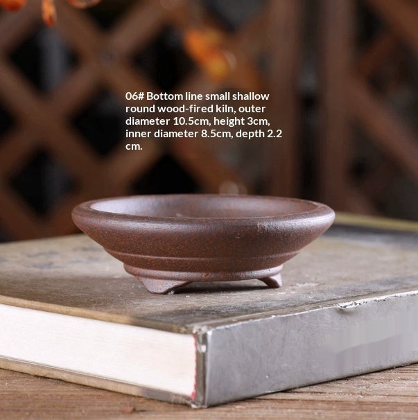 Small shallow brown round bonsai pot on low feet, with dimensions above