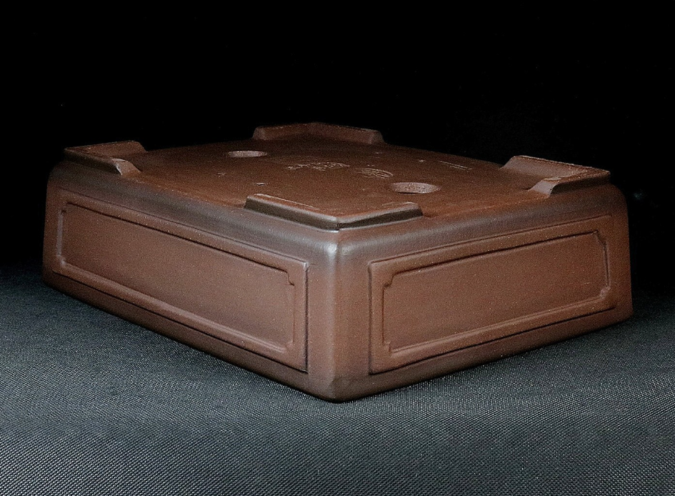 Angled upside-down view of the brown paneled pot