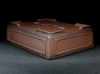 Angled upside-down view of the brown paneled pot