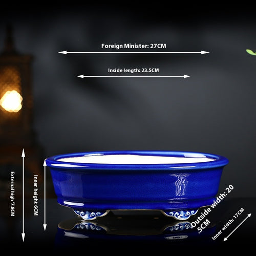 Cobalt blue oval bonsai pot with decorative feet and exterior and interior measurement arrows