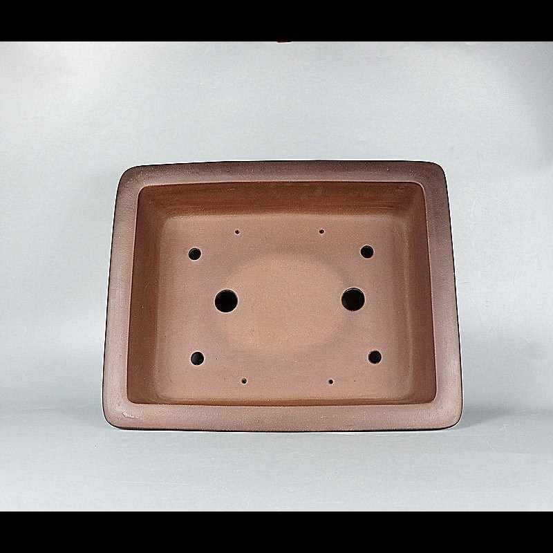 Top view of brown rectangular pot showing two large openings and additional smaller holes