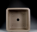 Top view of taupe square pot showing central opening and four small holes