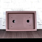 Top view of brown rectangular pot showing two large openings and four small holes