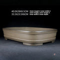 Angled rounded rectangular pot with dimension annotations