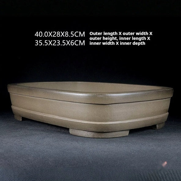 Angled rounded rectangular pot with dimension annotations