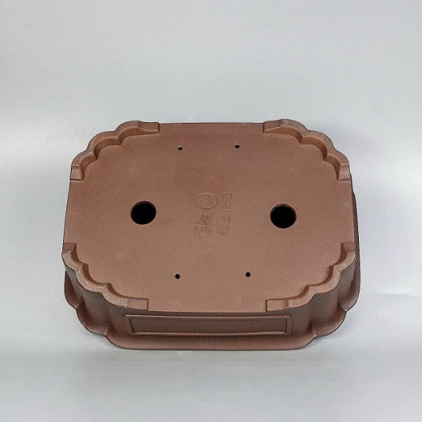 Mokko pot underside showing drainage and wiring holes