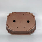 Mokko pot underside showing drainage and wiring holes