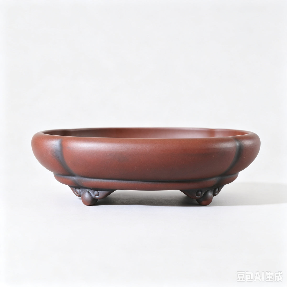Alternate front view of red-brown lobed bonsai pot with dark accents