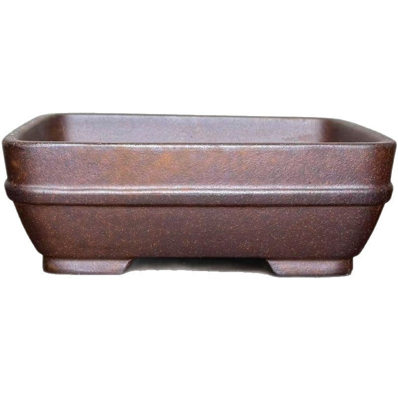 Rectangular brown stoneware bonsai pot on white background