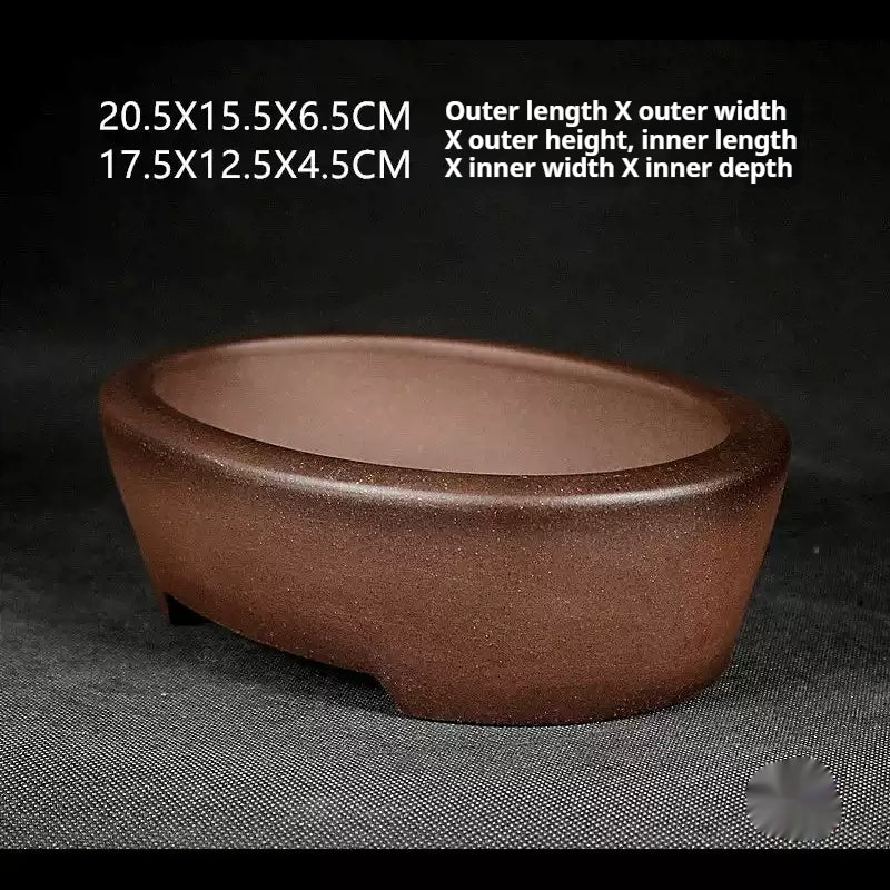 Angled brown oval pot with exterior and interior size labels