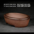 Angled brown oval pot with exterior and interior size labels