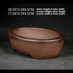 Angled brown oval pot with exterior and interior size labels