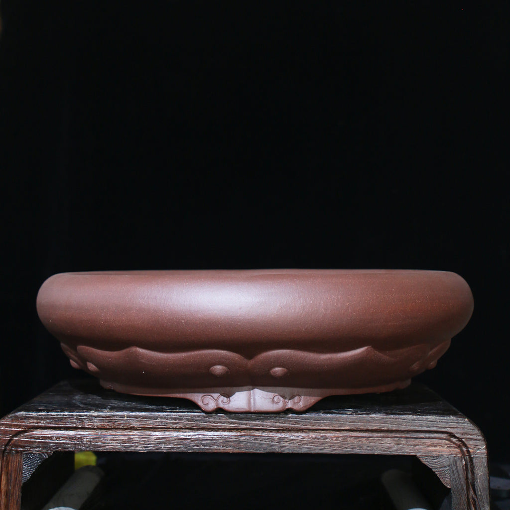 Brown round bonsai pot with broad rolled rim and raised petal decoration