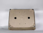 Underside of taupe rectangular pot showing two large openings and corner feet