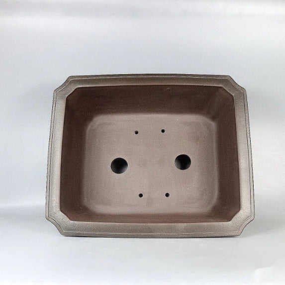 Top view of brown rectangular pot with two large openings and clipped corners