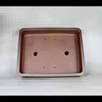 Top view of brown rectangular bonsai pot showing two large openings and small holes