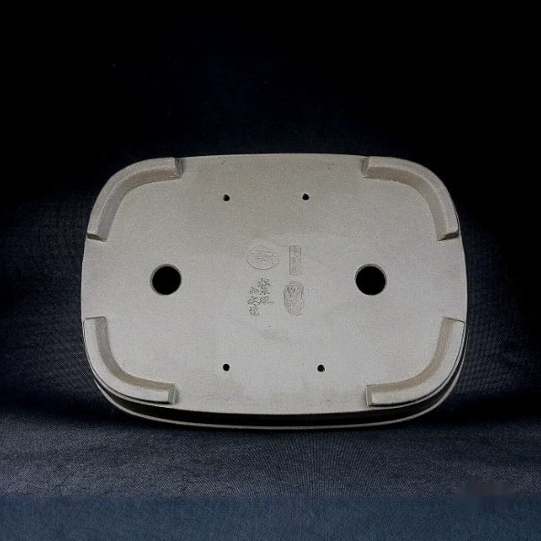 Underside of the rounded rectangular pot with drainage and smaller openings