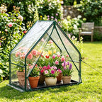Portable mini greenhouse shown on a garden lawn
