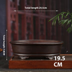 Oval purple-clay pot with exterior measurements