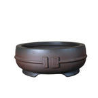 Dark-brown round bonsai pot on white background