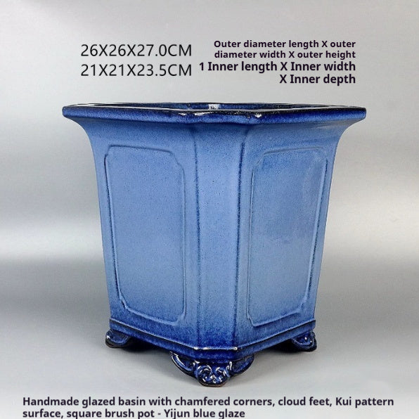 Angled blue square pot with paneled sides, decorative feet and measurement labels