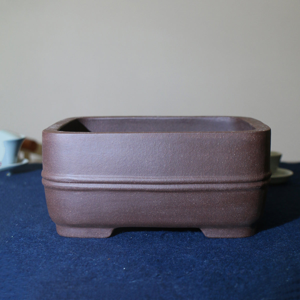 Purple-brown rounded rectangular bonsai pot with double band