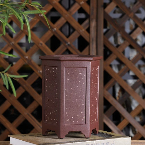 Tall reddish-brown hexagonal bonsai pot with pale speckles and recessed panels