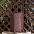 Tall reddish-brown hexagonal bonsai pot with pale speckles and recessed panels
