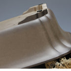 Close-up of taupe pot wall and raised underside foot
