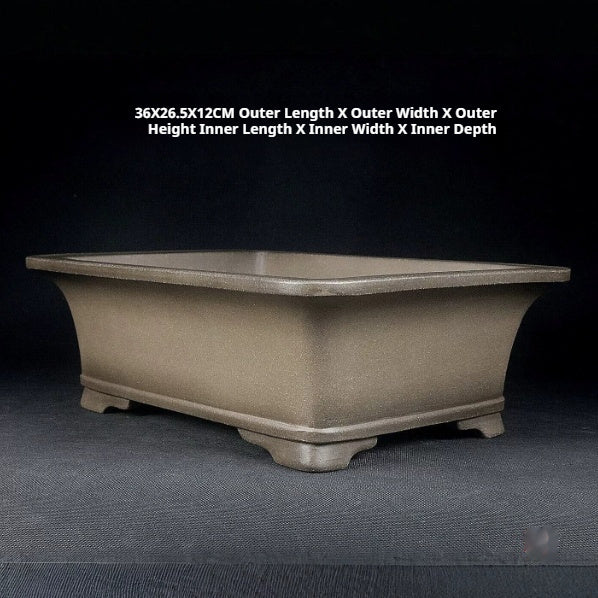Angled taupe rectangular pot with exterior size labels