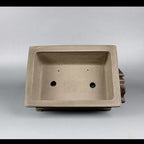 Interior of the taupe rectangular pot with drainage openings