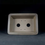 Interior of the taupe rectangular pot with drainage openings