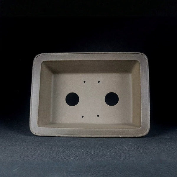 Interior of the taupe rectangular pot with drainage openings
