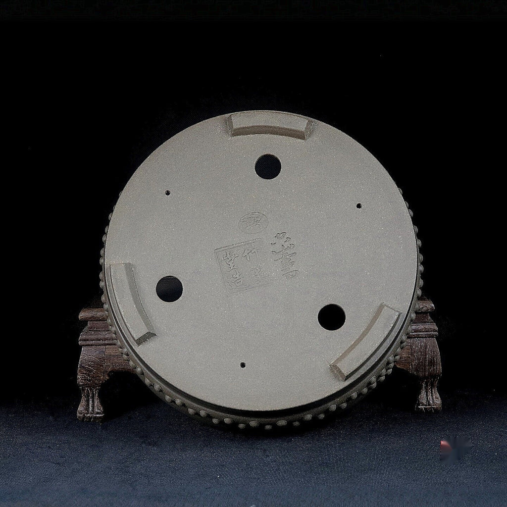 Gray drum bonsai pot underside showing drainage and wiring openings