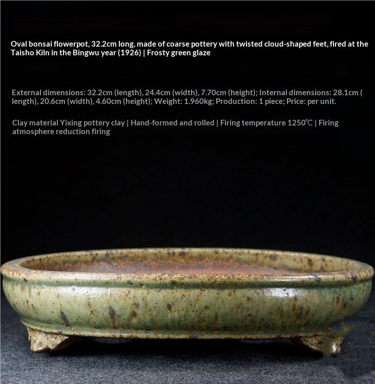 Pale green speckled oval bonsai pot with a rounded rim and decorative feet, with dimensions above