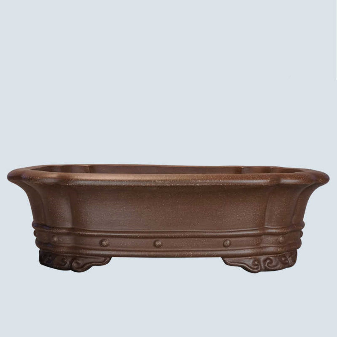 Brown lobed rectangular bonsai pot with raised studs and curled feet