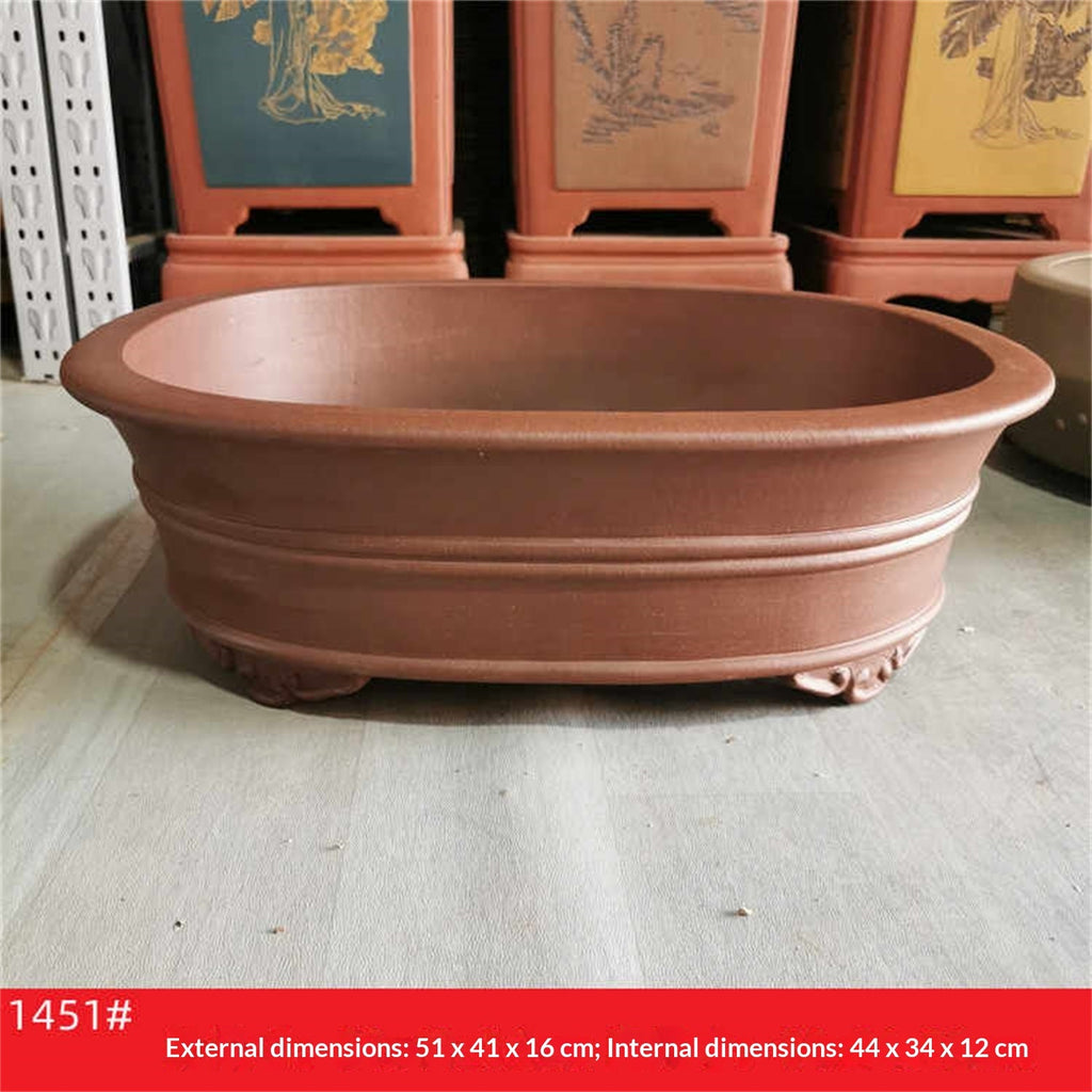 Brown oval pot with exterior and interior measurement label below
