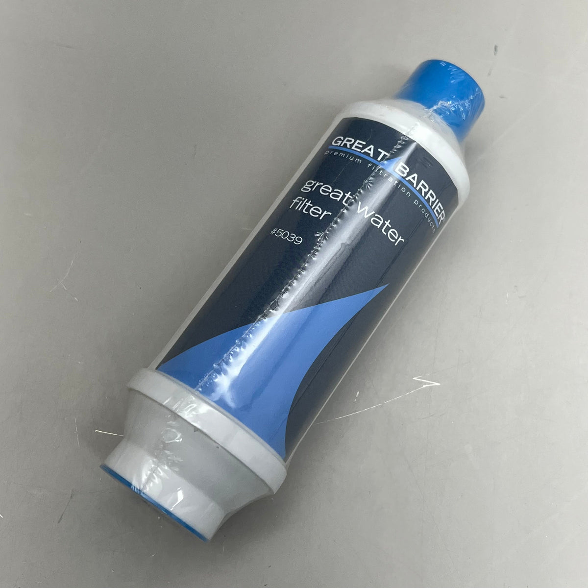 White cylindrical Great Barrier hose filter with blue end cap and dark blue label
