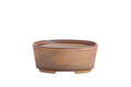 Tan-brown oval bonsai pot with subtle darker glaze sweeps and low feet
